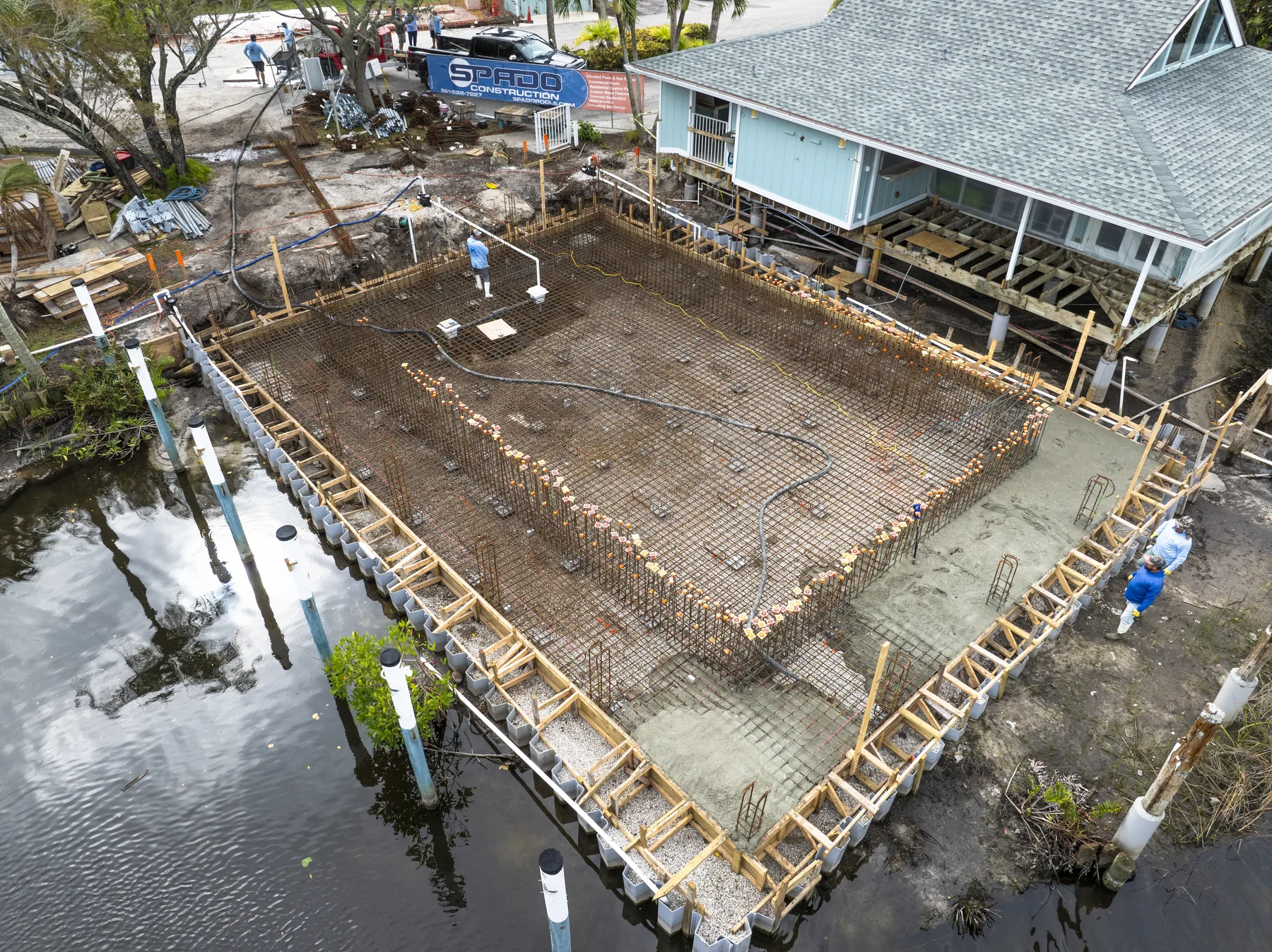 Hutchinson House waterfront pool construction with structural rebar and forming
