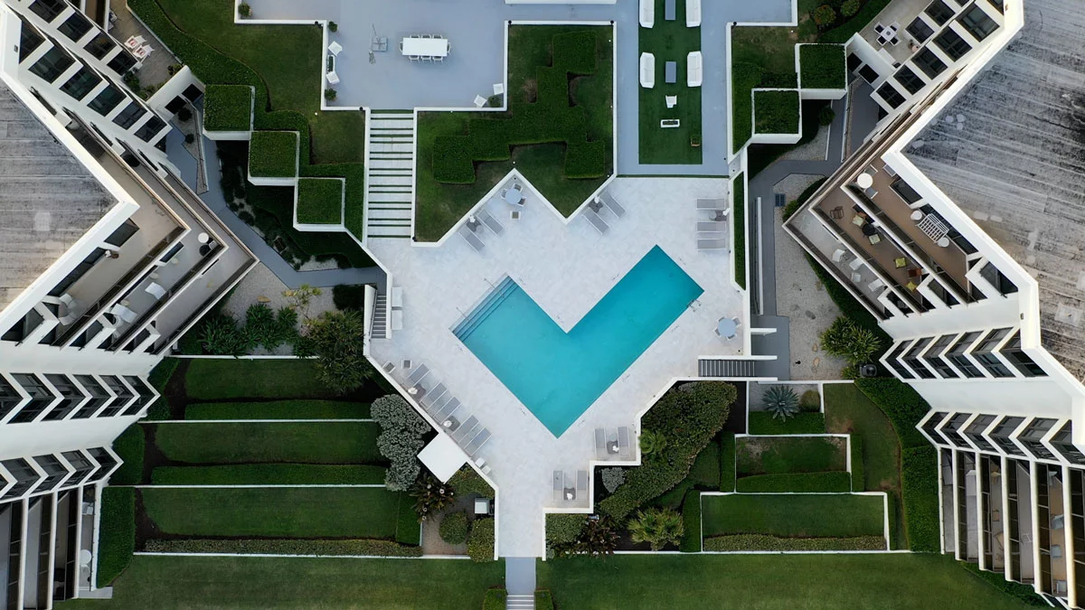 Oasis Palm Beach pool and outdoor amenity area aerial view